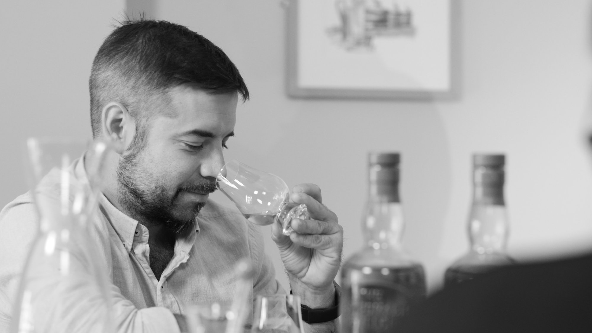 An image of our Benromach Champions nosing a glass of Benromach Speyside Single Malt Scotch Whisky