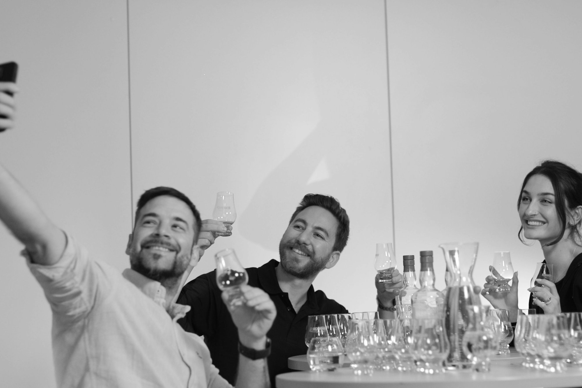 An image of three people drinking Benromach single malt scotch whisky An image of three people drinking Benromach single malt scotch whisky